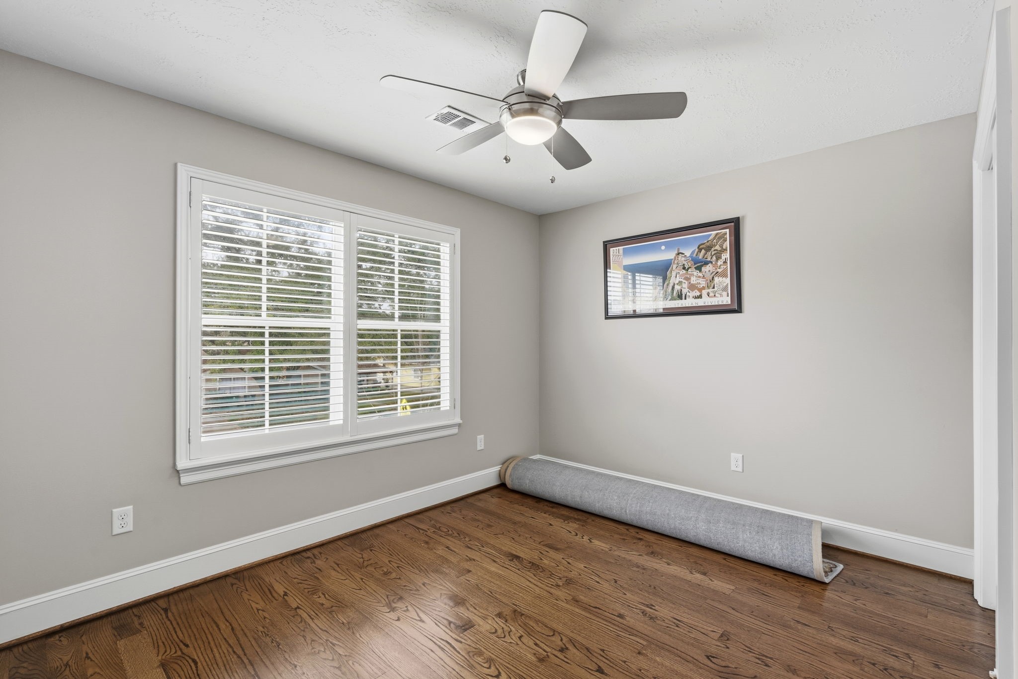 1938 Pech Road Houston, TX 77055 - Photo 34 of 39 a view of an empty room with wooden floor and a window