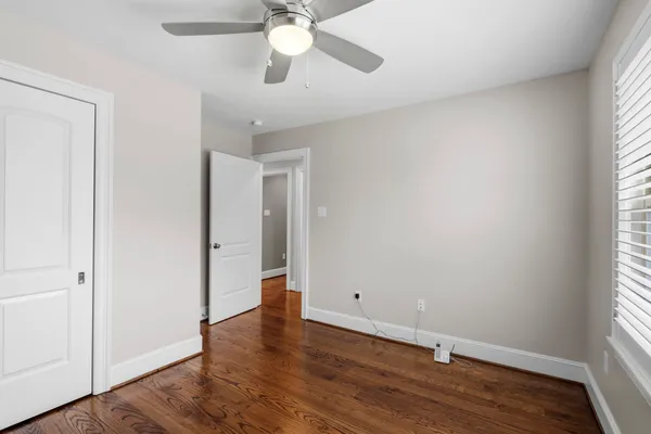 a view of a backyard with table and chairs and a barbeque
