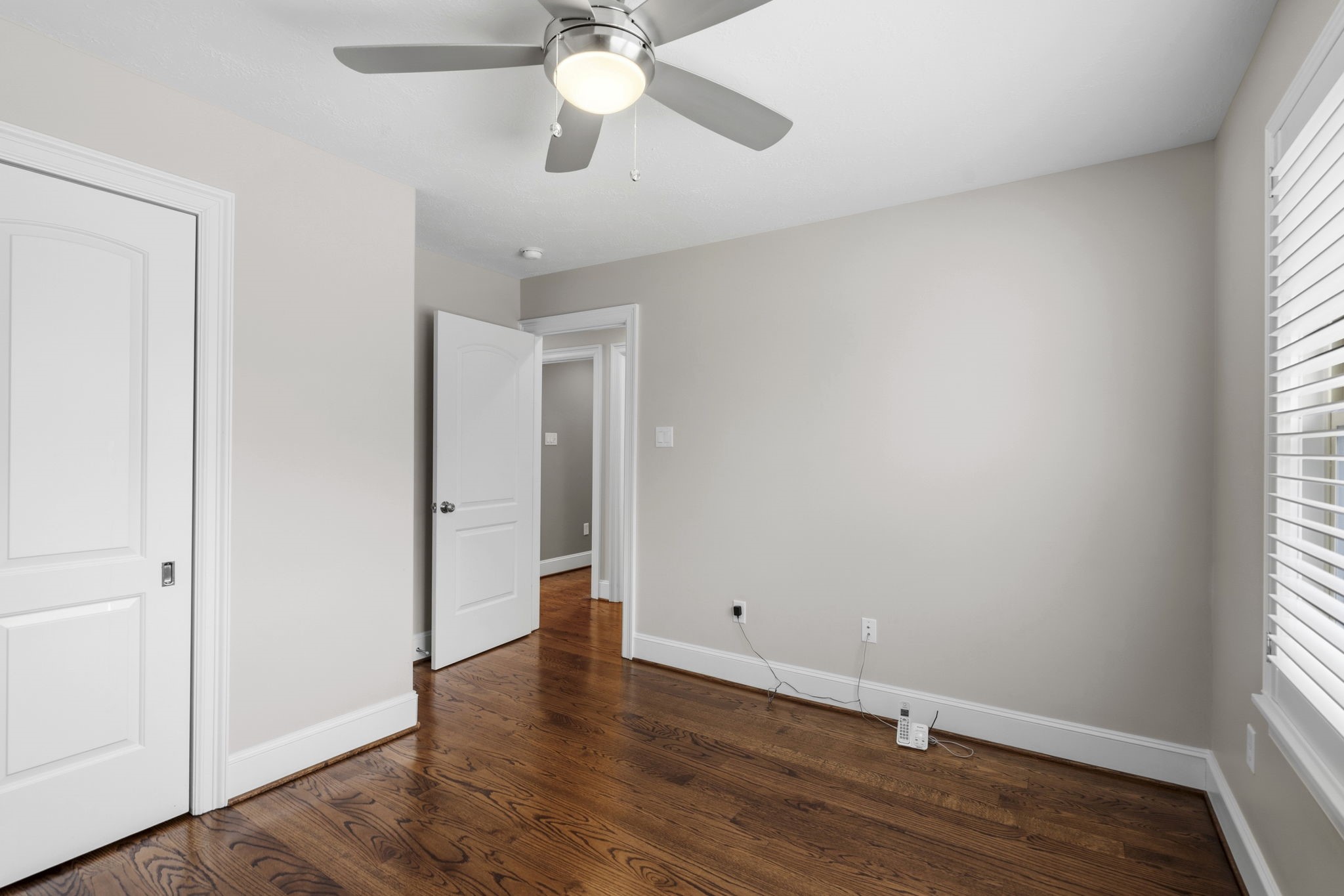 1938 Pech Road Houston, TX 77055 - Photo 35 of 39 an empty room with wooden floor and windows