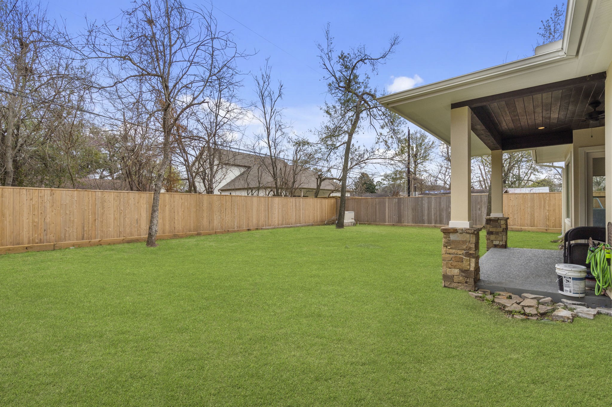 1938 Pech Road Houston, TX 77055 - Photo 38 of 39 a view of a backyard with table and chairs and a barbeque