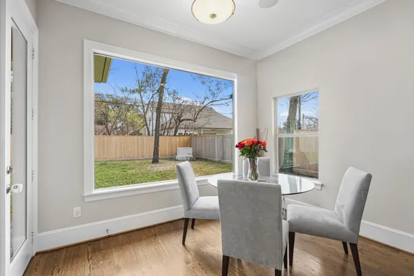 a view of a dining room with furniture window and outside view