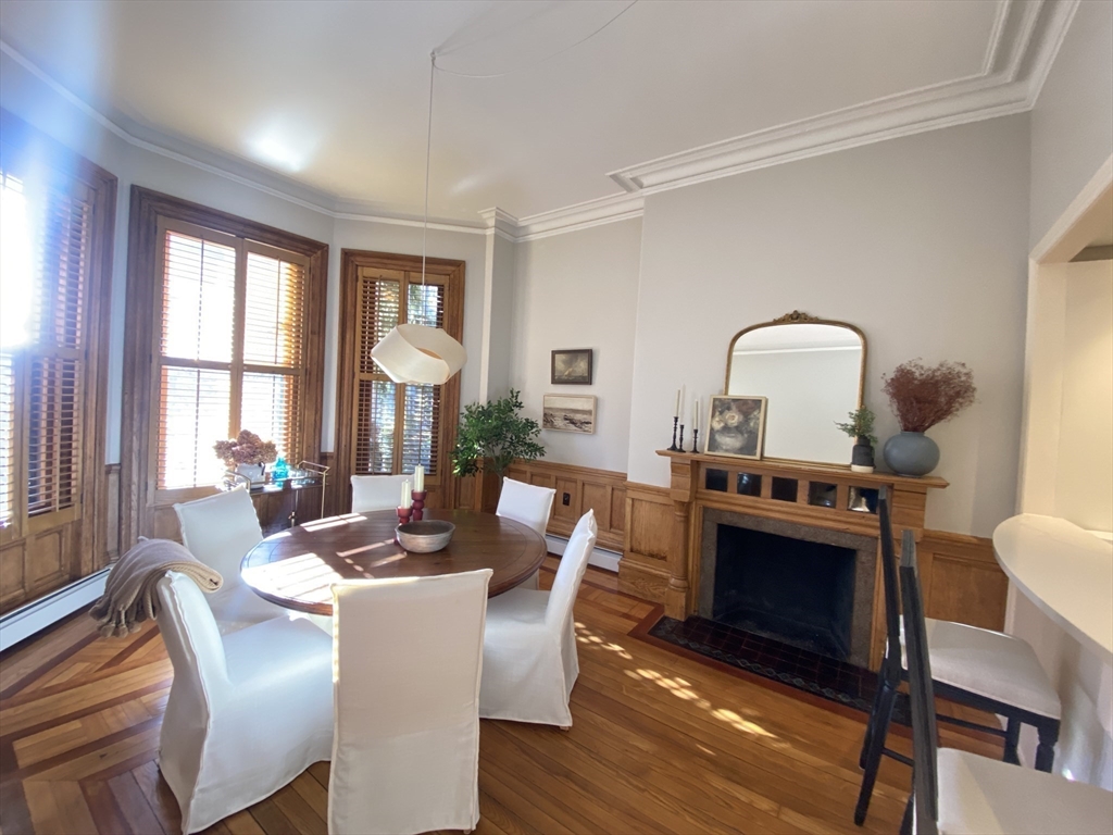 214 Commonwealth Avenue, Unit 1 Boston, MA 02116 - Photo 11 of 22 a living room with fireplace furniture and a window