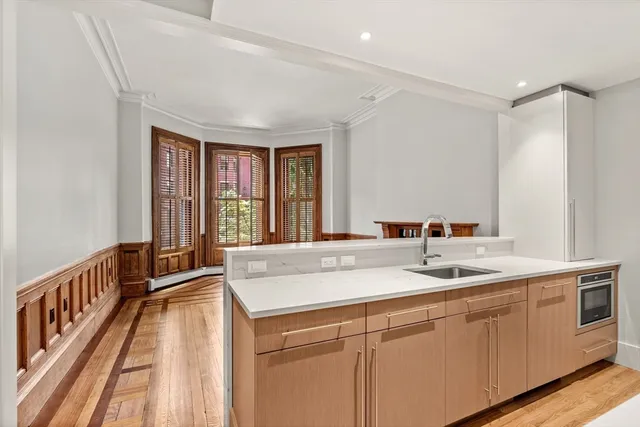 a kitchen with a sink and a window