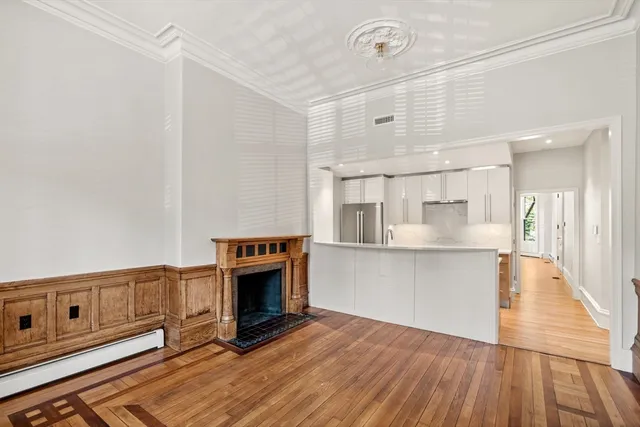 a kitchen with stainless steel appliances a stove top oven and a refrigerator