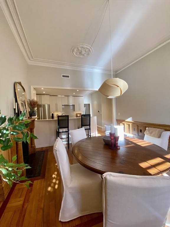 214 Commonwealth Avenue, Unit 1 Boston, MA 02116 - Photo 10 of 22 a view of a dining room with furniture