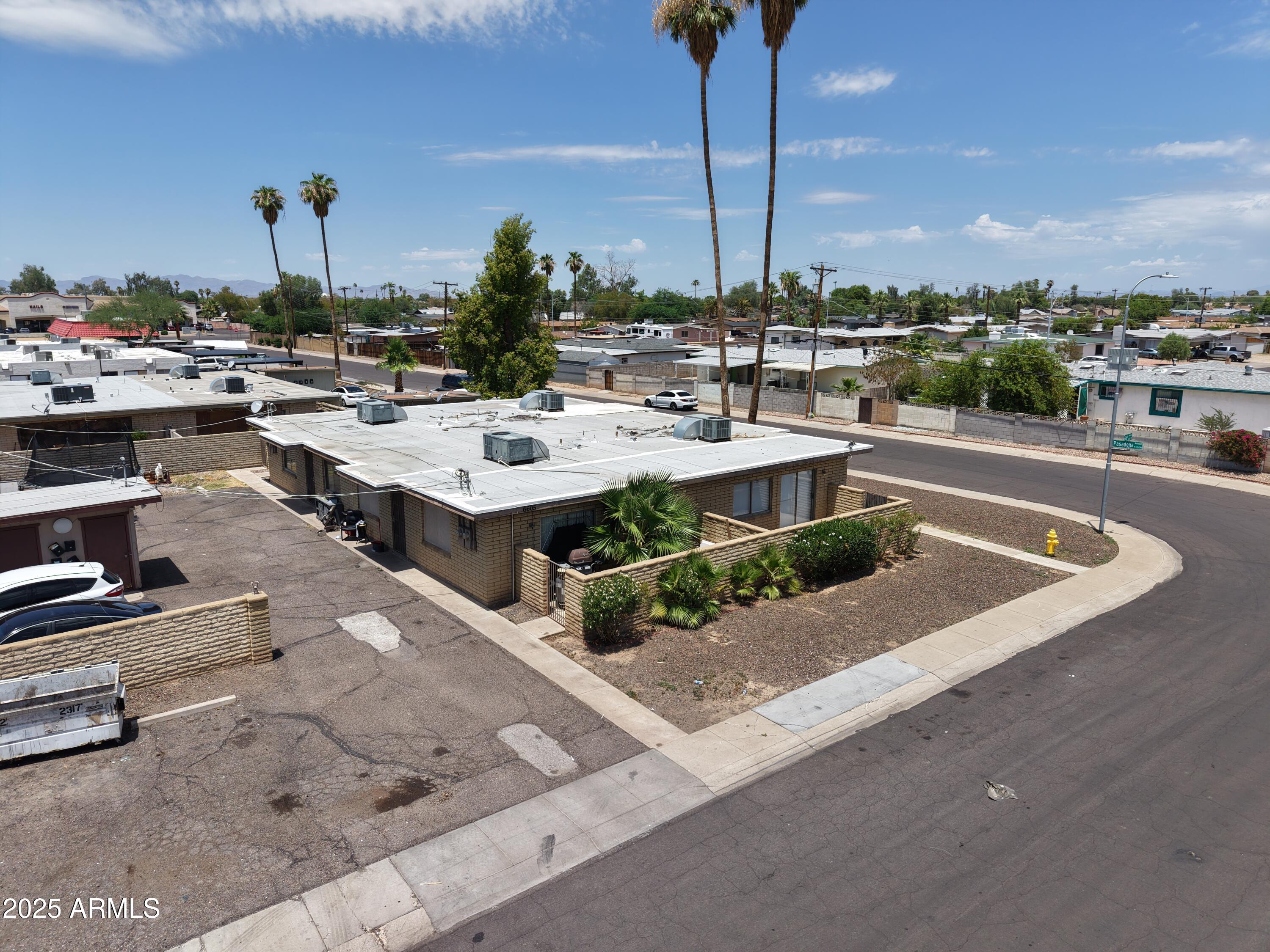 6605 West Pasadena Avenue Glendale, AZ 85301 - Photo 3 of 4 a view of a swimming pool with outdoor seating