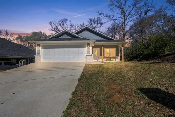 a front view of a house with yard
