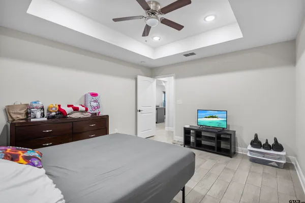 a bed room with a bed and a chandelier