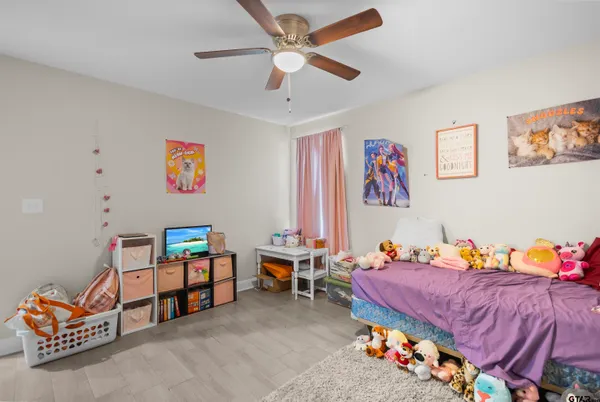 a bedroom with furniture and a bed
