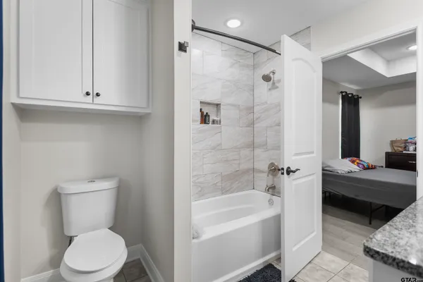 a bathroom with a toilet sink and bathtub