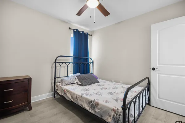 a bedroom with a bed and a dresser