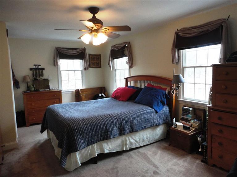 7 Park Road Mashpee, MA 02649 - Photo 5 of 9 a bedroom with a bed and a window