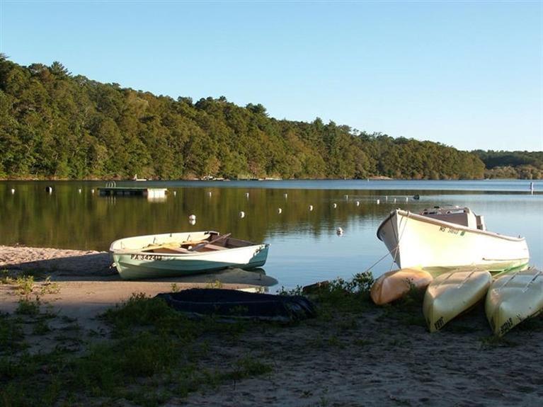 7 Park Road Mashpee, MA 02649 - Photo 7 of 9 a view of a lake with a yard