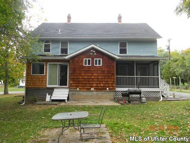 7 Cedar Street Rifton, NY 12471 - Photo 2 of 9 a backyard of a house with table and chairs