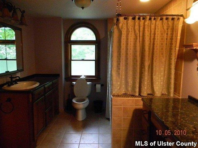 7 Cedar Street Rifton, NY 12471 - Photo 5 of 9 a bathroom with a sink a toilet and a mirror