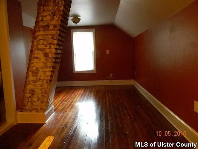 7 Cedar Street Rifton, NY 12471 - Photo 6 of 9 wooden floor in an empty room with a window