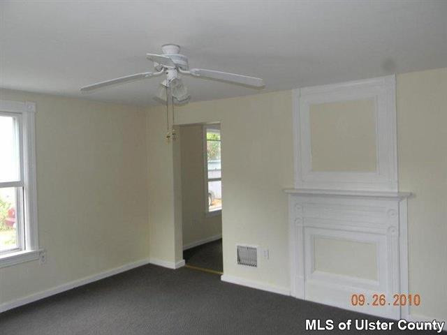 7 Cedar Street Rifton, NY 12471 - Photo 7 of 9 an empty room with windows and fan