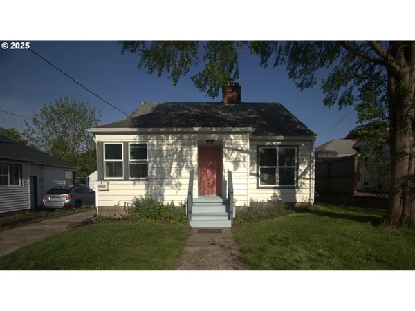 a black and white photo of a house