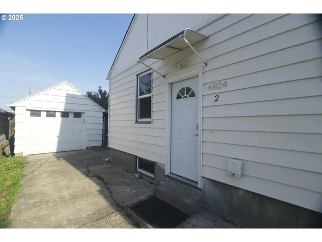 a view of a backyard of the house