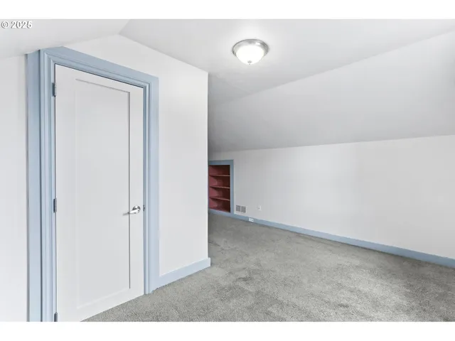 a balcony with furniture and a potted plant