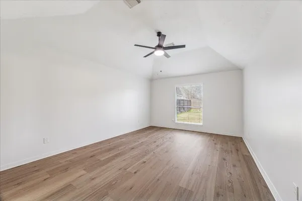 a large bathroom with a double vanity sink a mirror and a bathtub