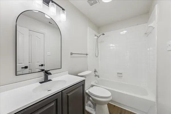 a bathroom with a sink a toilet and a bathtub