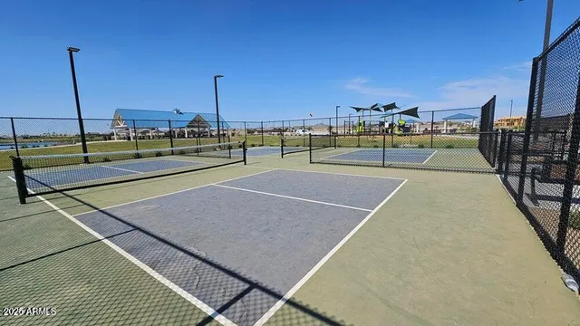 a view of a tennis court with basket ball court