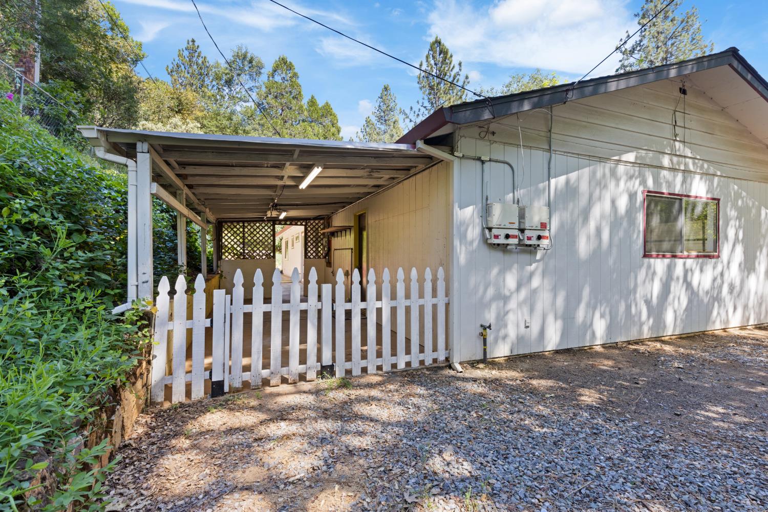 2971 Letitia Avenue Placerville, CA 95667 - Photo 49 of 65 a view of a house with a small yard and wooden fence