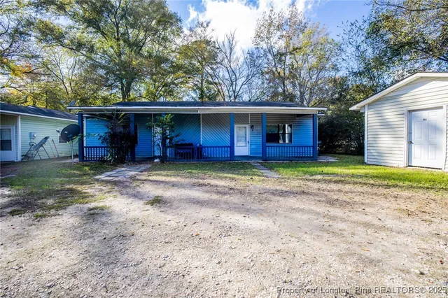 a house with trees in the background