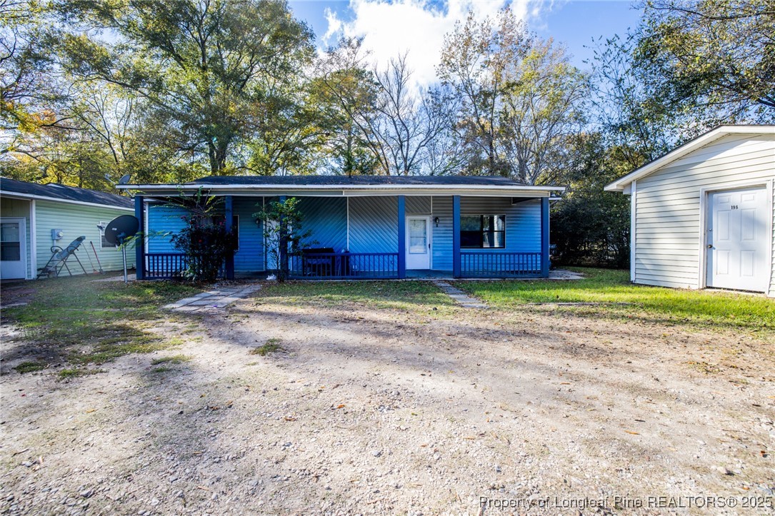 a house with trees in the background