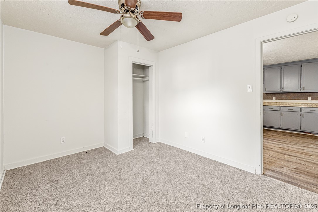 210 South Plymouth Street, Unit 1 Fayetteville, NC 28312 - Photo 12 of 26 a view of a kitchen with a sink and a refrigerator
