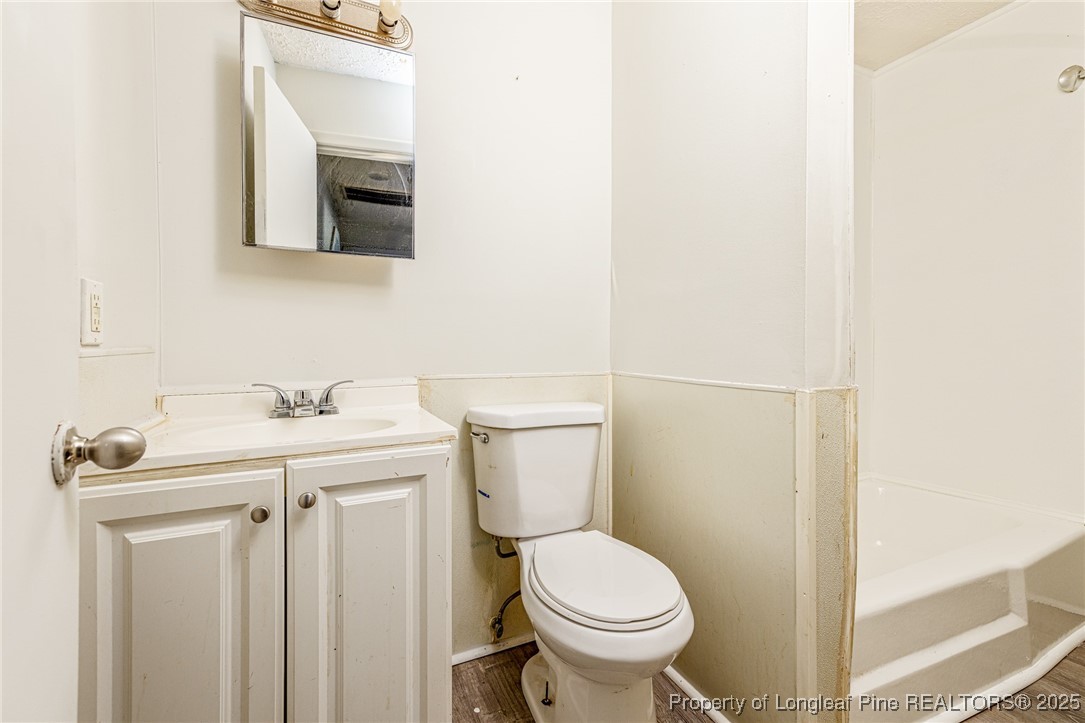 210 South Plymouth Street, Unit 1 Fayetteville, NC 28312 - Photo 24 of 26 a bathroom with a sink and a toilet