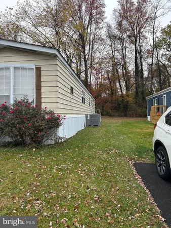 a view of a house with a yard and garage