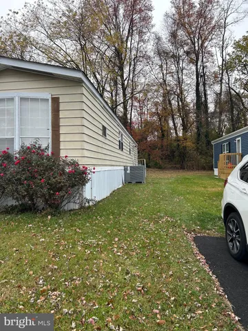 a view of a house with a yard and garage