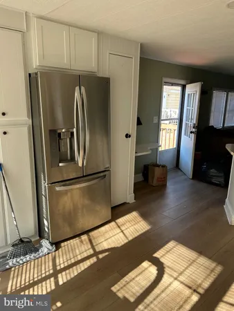 a kitchen with a sink cabinets and window