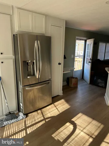 a kitchen with a sink cabinets and window