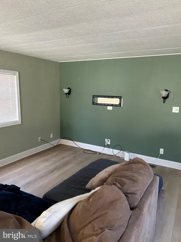 a kitchen with granite countertop a refrigerator and a sink