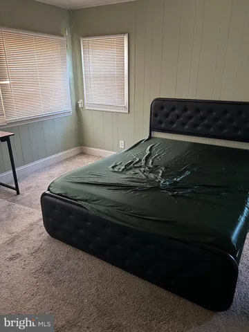 a view of kitchen with granite countertop window