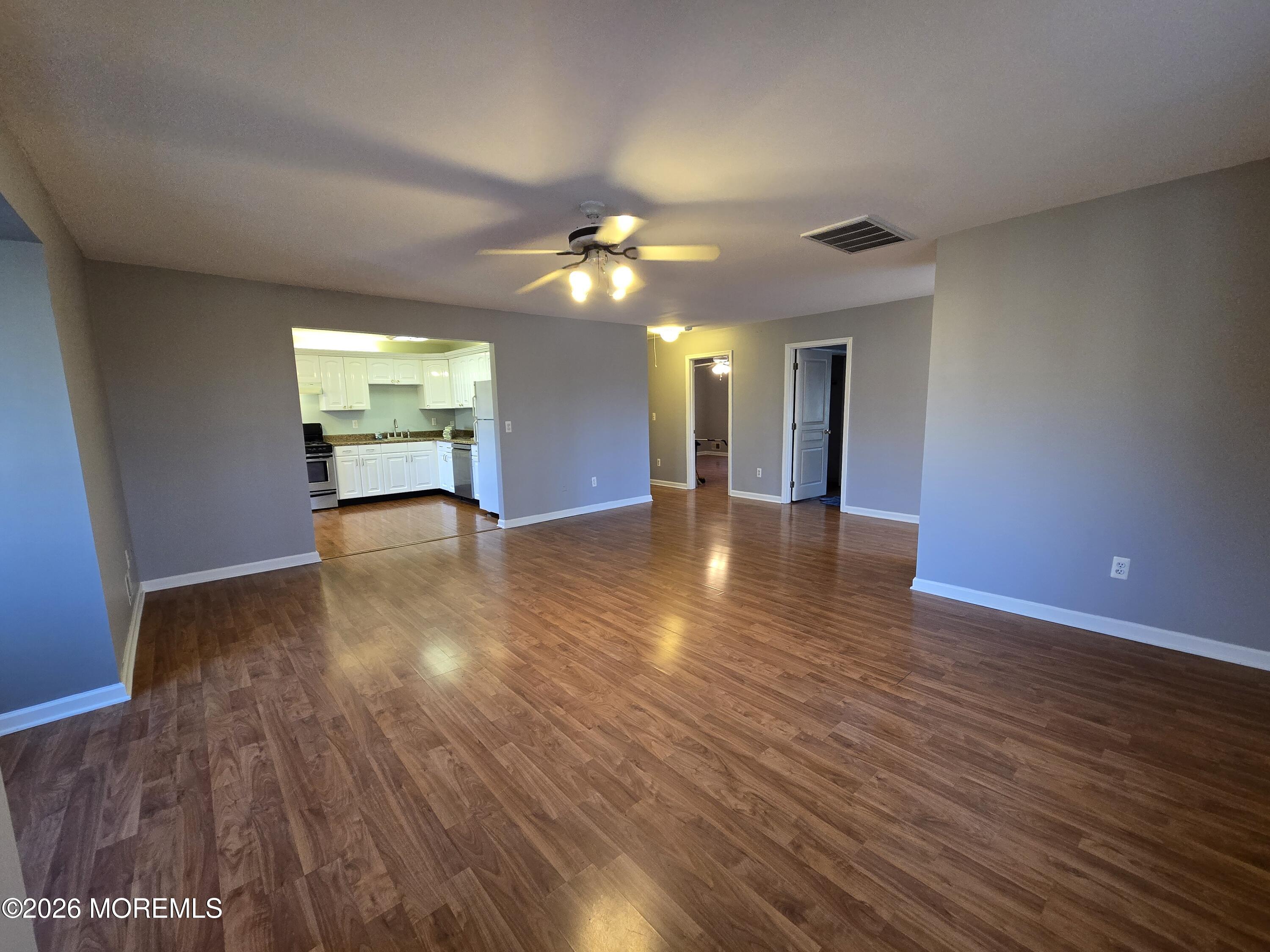 274 Easy Street, Unit RIGHT Howell, NJ 07731 - Photo 4 of 19 a view of a room with wooden floor