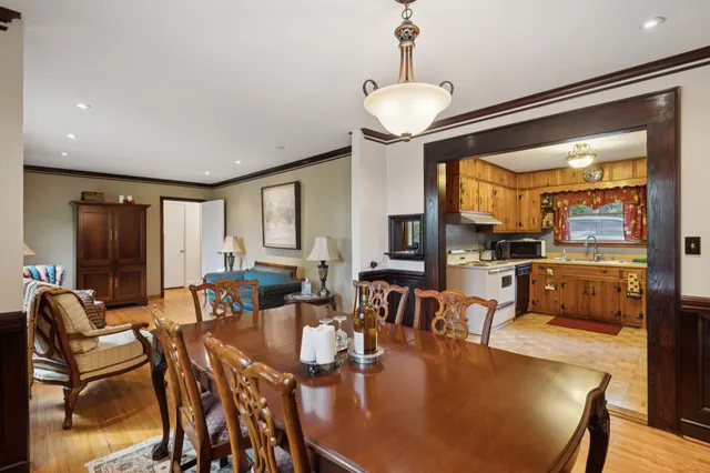 a kitchen with a stove a refrigerator and a sink