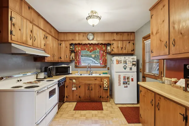 a view of kitchen with wooden floor