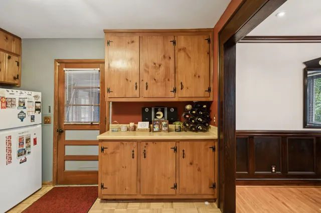 a view of a kitchen area with furniture and chandelier