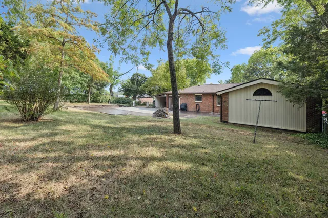 a backyard of a house with lots of green space