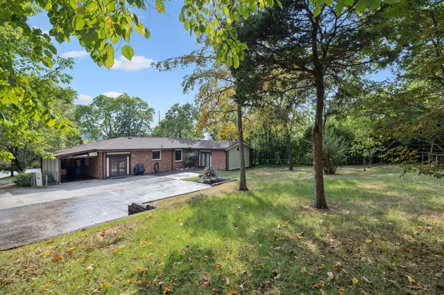 a backyard of a house with lots of green space