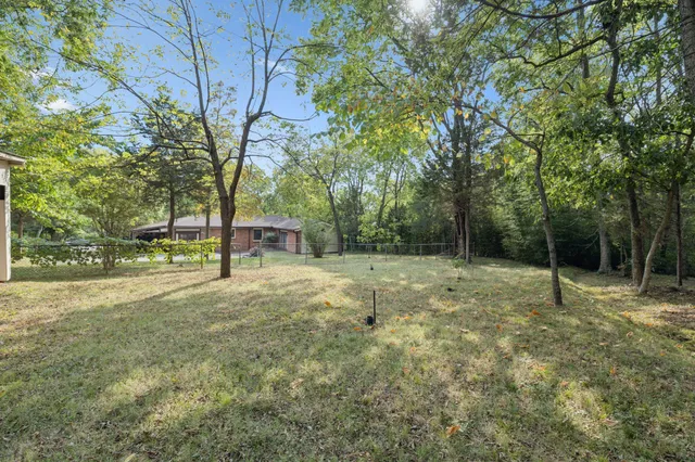 view of a lake with a house