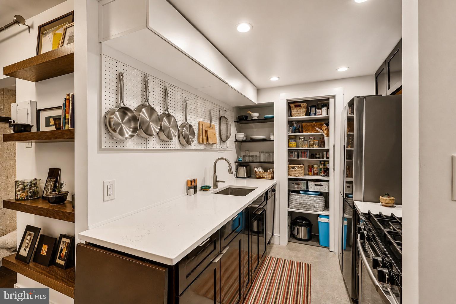 3701 Connecticut Avenue Northwest, Unit 416 Washington, DC 20008 - Photo 13 of 34 Sleek kitchen with modern storage solutions.
