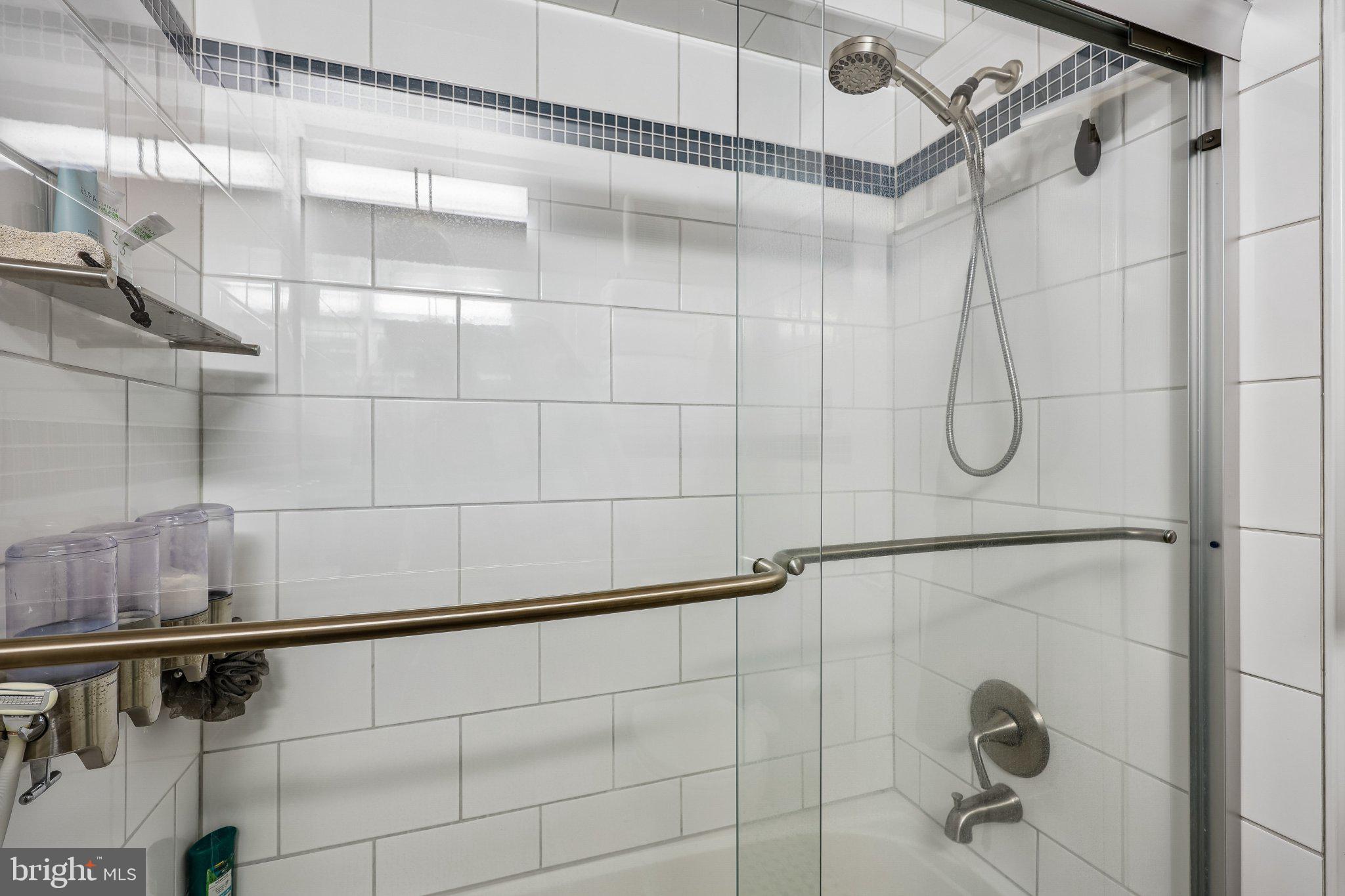 3701 Connecticut Avenue Northwest, Unit 416 Washington, DC 20008 - Photo 22 of 34 Sleek modern shower with elegant tiles.