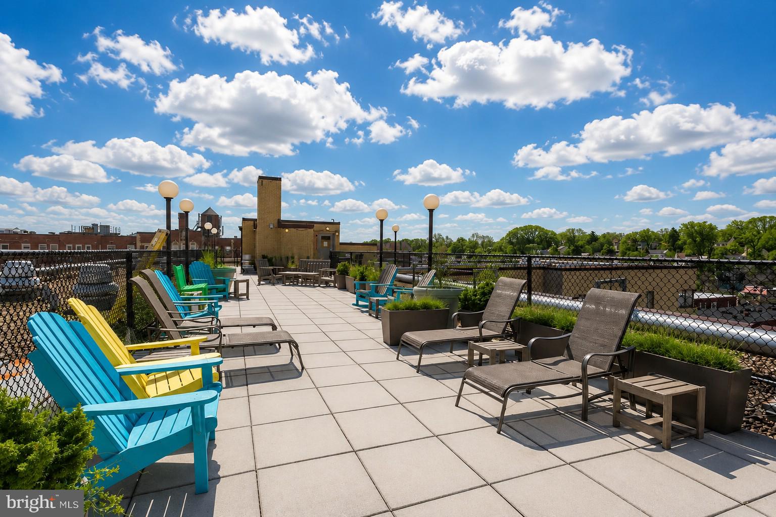 3701 Connecticut Avenue Northwest, Unit 416 Washington, DC 20008 - Photo 24 of 34 Sunny rooftop retreat with vibrant seating.