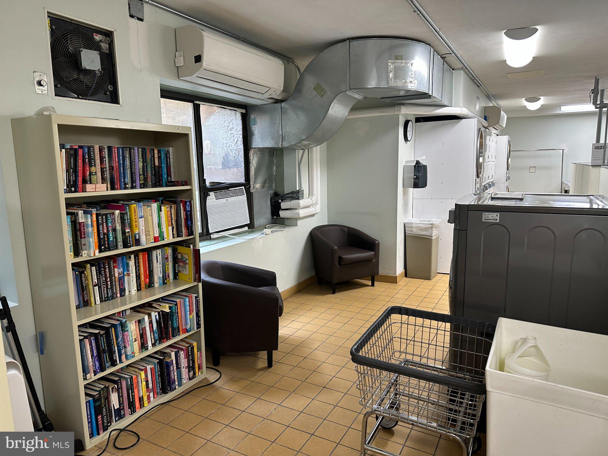 3701 Connecticut Avenue Northwest, Unit 416 Washington, DC 20008 - Photo 29 of 34 Cozy laundry nook with a bookcase.
