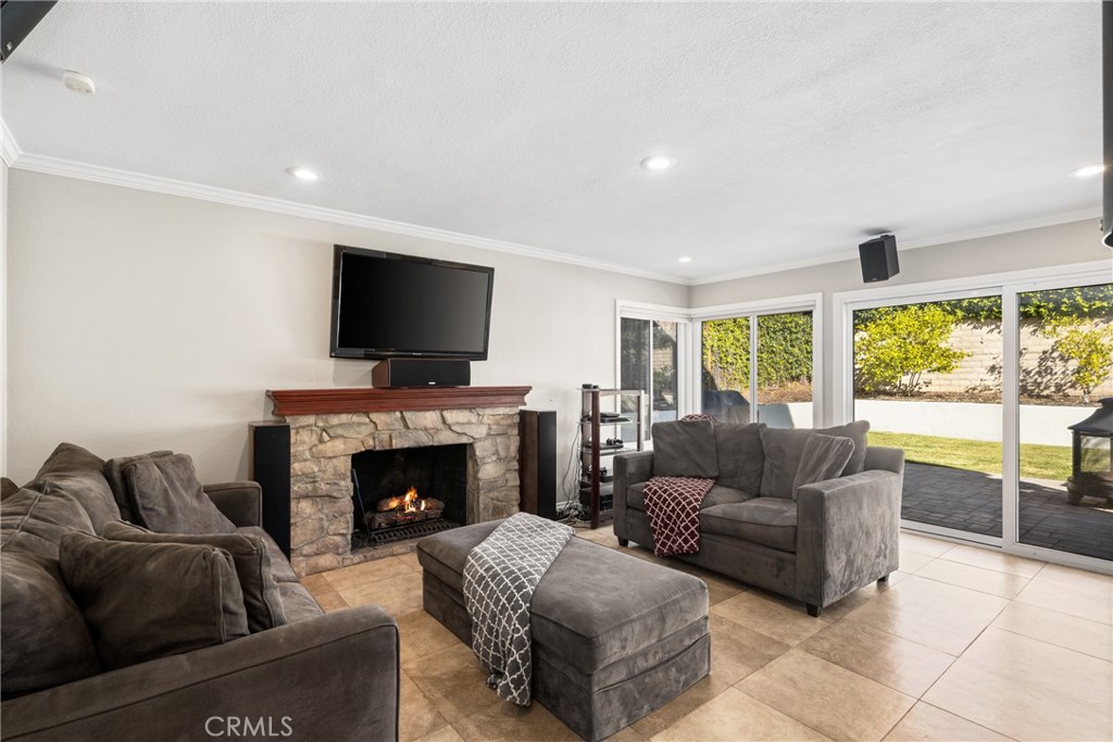 25671 Westover Circle Lake Forest, CA 92630 - Photo 10 of 37 a living room with furniture and a fireplace